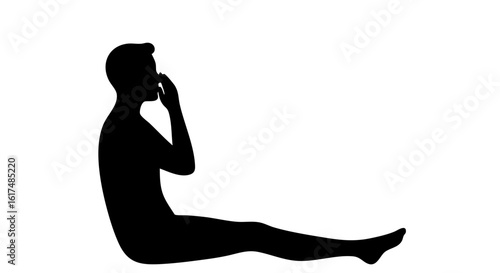 A silhouette of a person sitting and reflecting. 