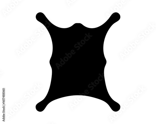 Silhouette of animal hide, suggesting a rug, pelt, or primitive garment