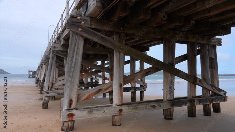 Wide shot of the wooden frame of the Coffs Harbour Jetty, New South Wales Australia Wide shot of the wooden frame of the Coffs Harbour Jetty, New South Wales Australia