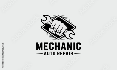 A robust design featuring a clenched fist holding a wrench symbolizes strength, skill, and craftsmanship in the automotive repair industry, showcasing a mechanic's dedication.