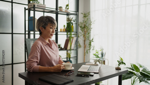 Senior business asian woman mature working in office
