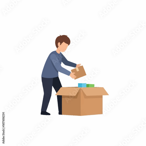 A young man carefully packing or unpacking items into a large open cardboard box, isolated on a white background.