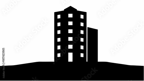 Silhouette of a tall building with many windows standing on a dark hill against a white background