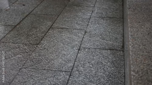 4K Video of Rain Droplets Cascading from Eaves