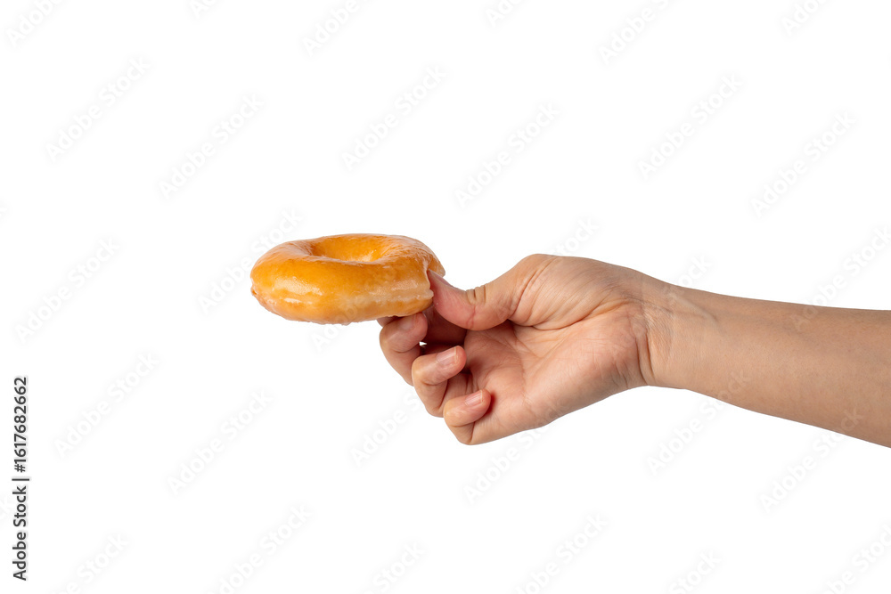 Glazed donut in hand on transparent background Glazed donut in hand on transparent background