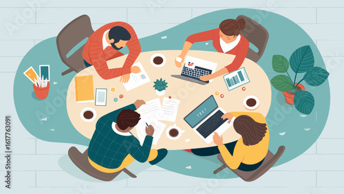 Top view of diverse team collaborating around a table, ideal for illustrating teamwork, brainstorming, and project collaboration.