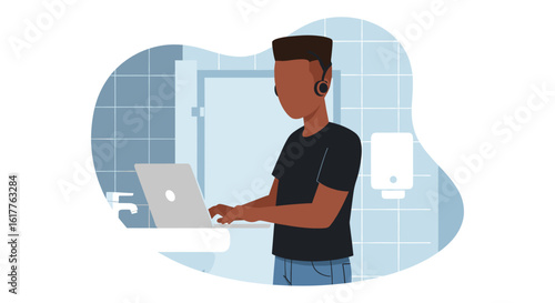 Young man working on laptop in a modern bathroom - perfect for illustrating remote work, flexibility, or modern lifestyle.