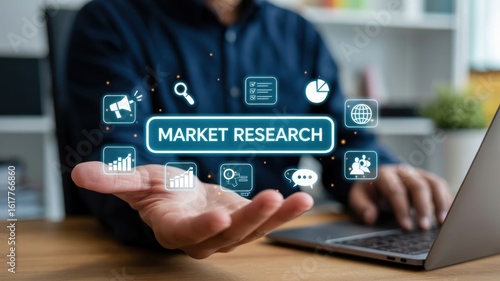 Strategic Market Research: A person interacting with a laptop displaying a 