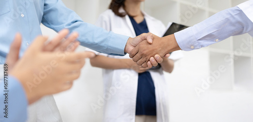 Doctors shaking hands in meeting room at hospital , Healthcare and medical concept.