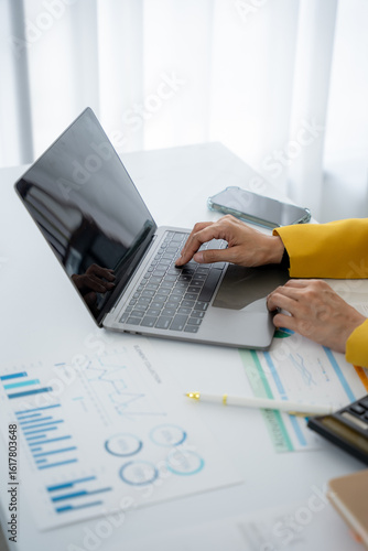 Analyzing Data: A focused professional engrossed in the analytical aspects, navigating data with precision, charts, graphs, calculators and financial reports creating an impactful scene of expertise.