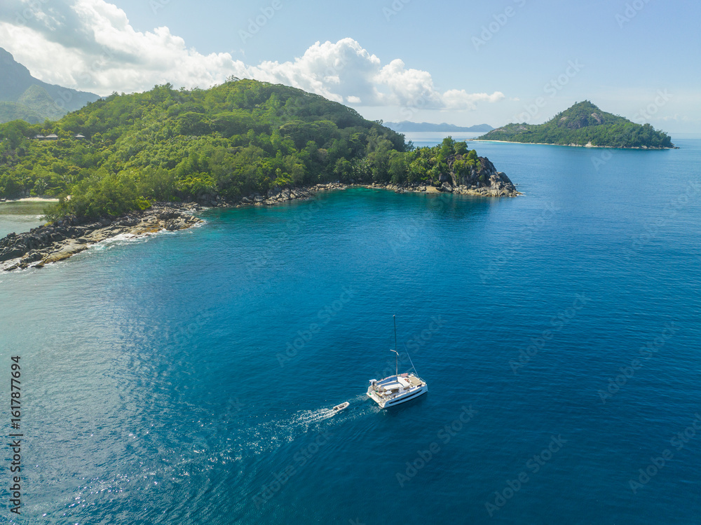 Aerial view of Seychelles coast with sailing boat Aerial view of Seychelles coast with sailing boat