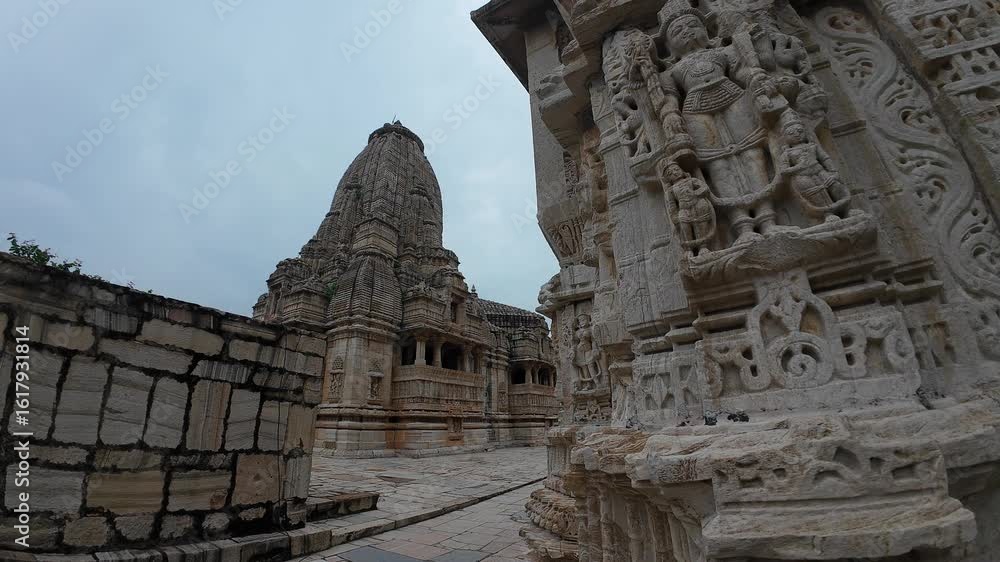 Majestic Exterior View of Meera Temple with Intricate Stone Carvings at Chittorgarh Fort Complex Majestic Exterior View of Meera Temple with Intricate Stone Carvings at Chittorgarh Fort Complex