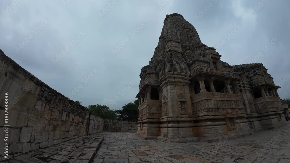 Majestic Exterior View of Meera Temple with Intricate Stone Carvings at Chittorgarh Fort Complex Majestic Exterior View of Meera Temple with Intricate Stone Carvings at Chittorgarh Fort Complex