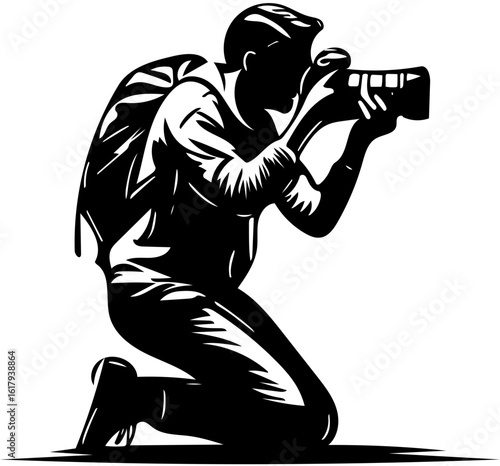 Silhouette of a photographer kneeling and taking a picture with a professional camera and backpack.