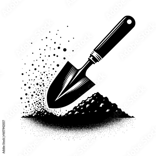 Gardening trowel digging into soil with scattered dirt particles