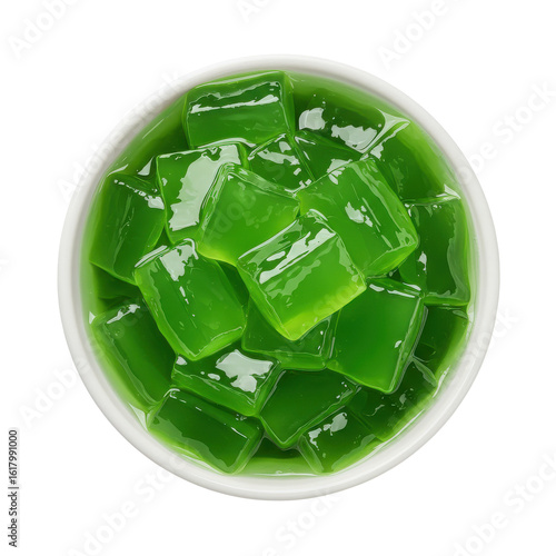 A top-down view of a bowl filled with vibrant green jelly cubes, showcasing their glossy texture