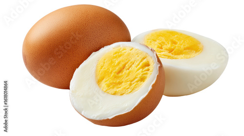 Two brown eggs, one cut in half showing bright yellow yolk and white, isolated on a white background.