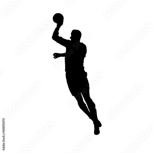 A Silhouette of a Basketball Player in Action.