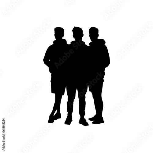 Three friends standing together in silhouette.