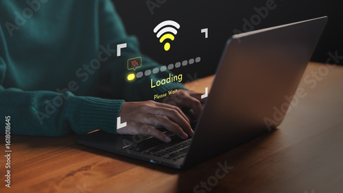 Person using a laptop computer with slow internet connection icon and loading screen interface. Concept of technology delay, network issues, data buffering and low Wi-Fi signal during online activity.