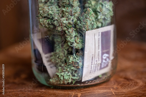 Glass jar with homegrown dried cannabis marijuana buds and humidity control packs