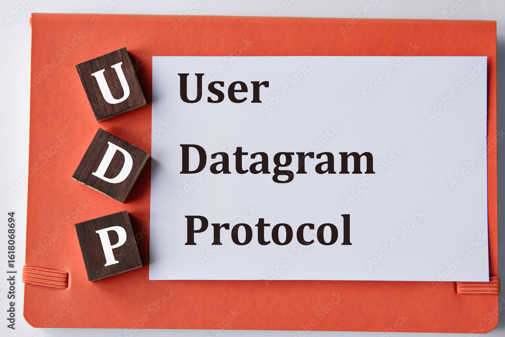 Fototapeta premium USER DATAGRAM PROTOCOL - words on a white sheet with a red background