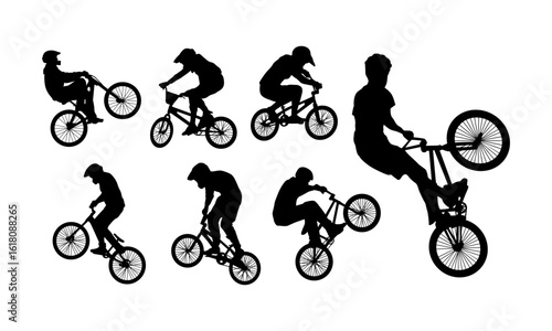 silhouettes of bmx riders performing stunts