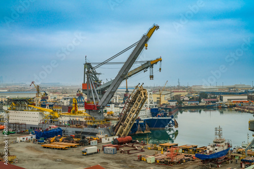 ships being loaded and unloaded of goods and other things at Baku in Azherbaijan
