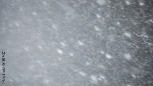 Heavy Snowfall Creating Dense White Flurry in Cold Winter Environment