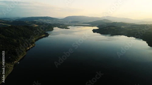 Wallpaper Mural Stunning aerial drone shot of a peaceful lake at sunset in Poland. Warm golden light reflecting on calm water, soft evening colors, and tranquil natural scenery. Beautiful Polish landscape Torontodigital.ca
