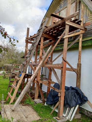 Do-it-yourself renovation of an old building using scaffolding.