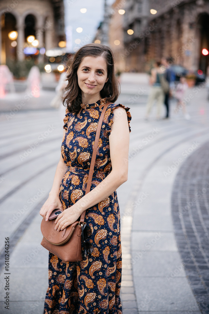 Fototapeta premium Young woman smiling in piazza de ferrari, genoa, italy