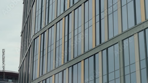 Wallpaper Mural POV shot from inside car driving through streets of modern city. Windshield view urban landscape, modern architecture buildings windows glass in slow motion, cloudy summer day Torontodigital.ca