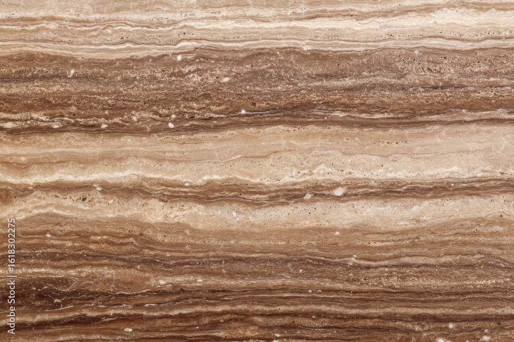 Naklejka premium Elegant brown travertine marble surface for luxurious interiors and upscale architectural designs, perfect for home decor enthusiasts seeking sophistication and style improvements
