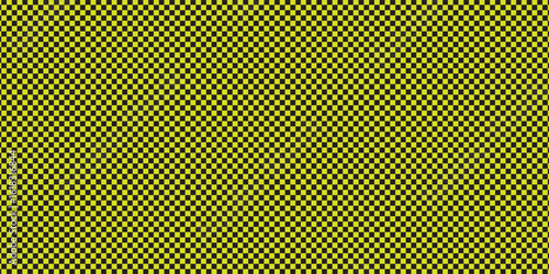 Checkerboard with very small squares. Black and Yellow colors of checkerboard. Chessboard, checkerboard texture. Squares pattern. Background. Repeatable texture.