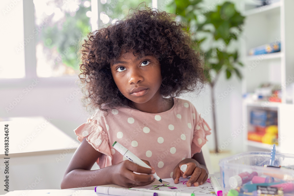 Fototapeta premium African american teenager painting colorful picture. Black people. Kid enjoy artwork.