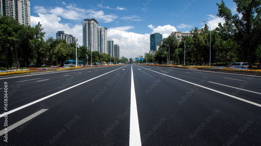 Empty city street, asphalt road stretches into the distance, modern buildings and trees line the sides, bright sunny day Empty city street, asphalt road stretches into the distance, modern buildings and trees line the sides, bright sunny day