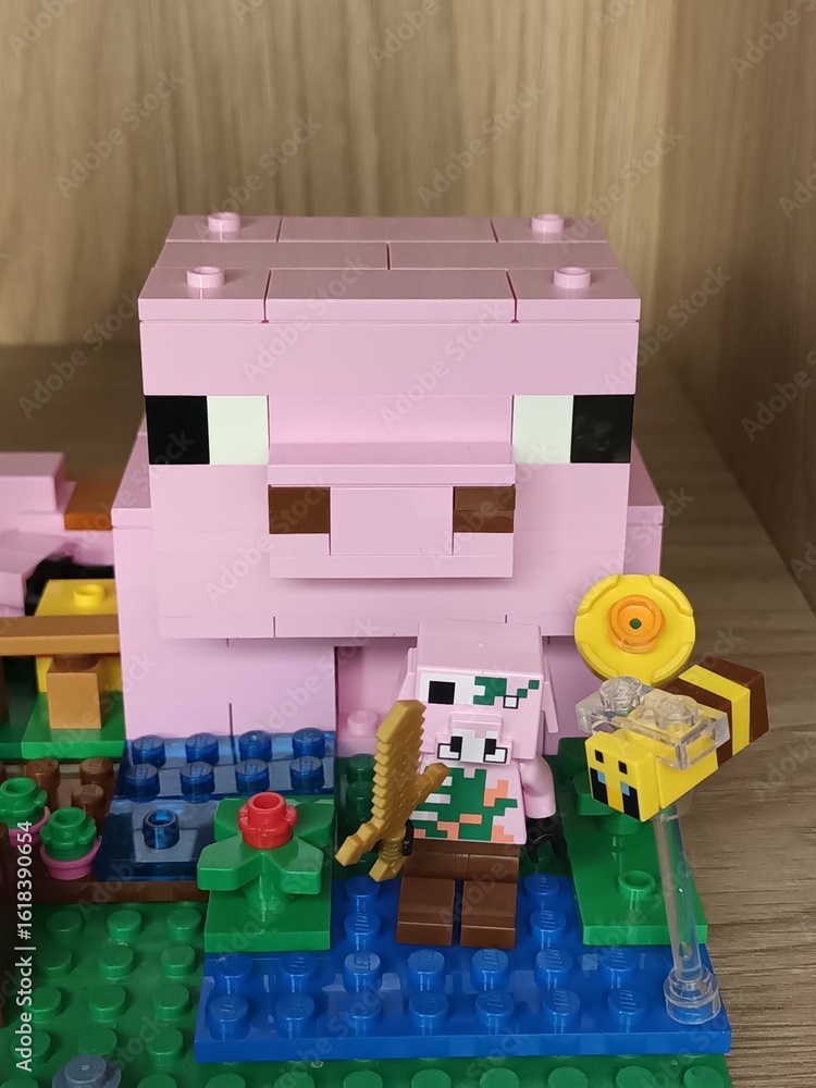 Naklejka premium Large and Small Lego Minecraft Pigs with Accessories