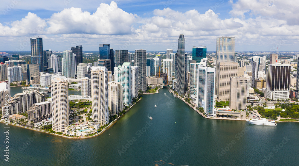 Fototapeta premium Drone view of Brickell skyscrapers. Brickell cityscape of downtown Miami. Panoramic Miami Brickell skyline above the coastline. Brickell Key aerial view in Miami. Landscape of Miami.
