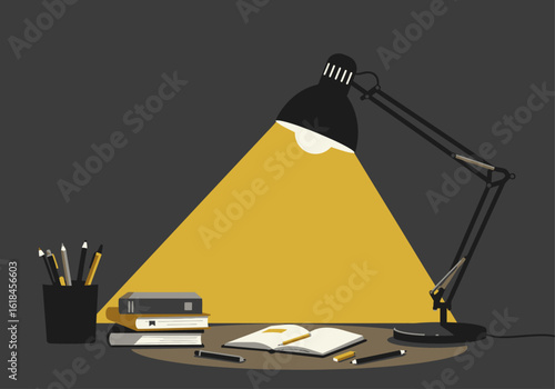 A black adjustable desk lamp shines a bright cone of light onto an open book and study materials.