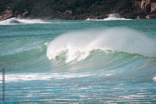 Waves of Praia do Rosa, Brasil. The power of the Atlantic after a huge storm. Big waves hitting the shore