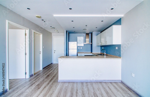 Clean unfurnished apartment interior showcasing spacious layout, raw architectural details, and abundant natural light. 