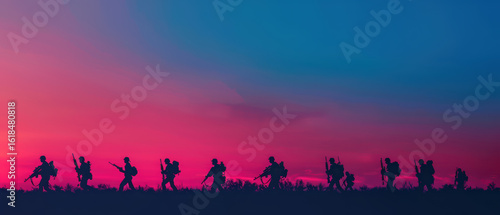 A group of soldiers are marching across a field at sunset