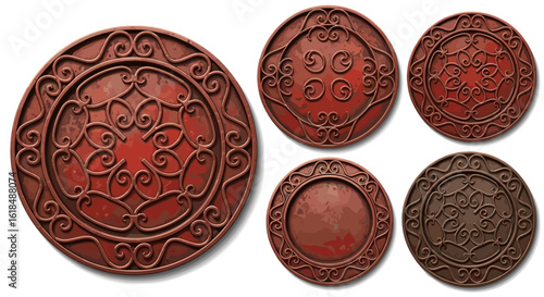 A collection of oval shaped decorative metal pieces with intricate scrollwork and reddish brown color tones