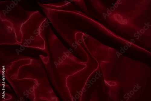 The luxurious red satin fabric surface is wavy and beautiful, conveying a deep love and relationship.