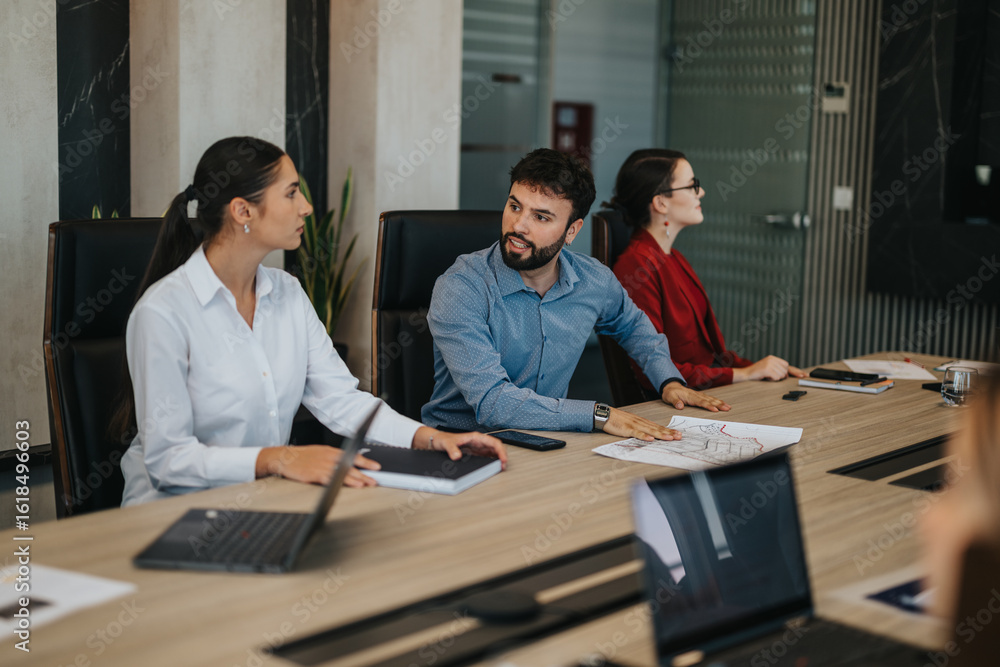 A diverse group of business people actively discussing strategies during a meeting in a modern conference room, showcasing teamwork and collaboration. The focus is on business growth and planning. A diverse group of business people actively discussing strategies during a meeting in a modern conference room, showcasing teamwork and collaboration. The focus is on business growth and planning.