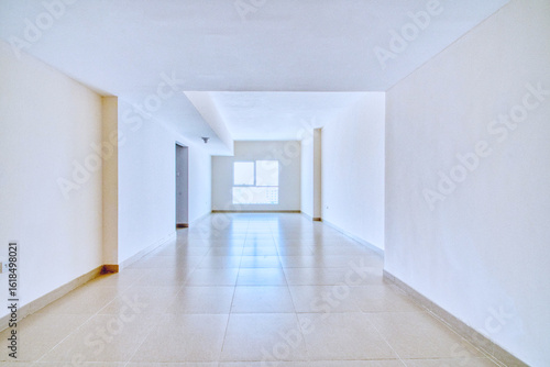 Clean unfurnished apartment interior showcasing spacious layout, raw architectural details, and abundant natural light. Ideal for real estate listings. Series shots