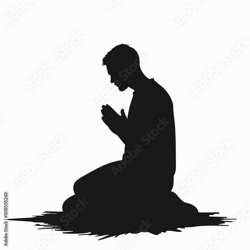 Man praying on knees in silhouette posture, expressing deep spirituality and reflection. The image captures calmness and peace in a moment of silent prayer.