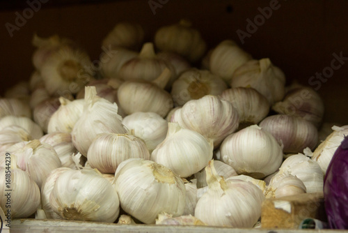 shelves in a vegetable store, brightly colored vegetables and fruits garlic 