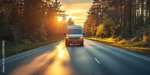 Fototapeta Naklejka Na Ścianę i Meble -  White modern delivery small shipment cargo courier van moving fast on motorway road to city